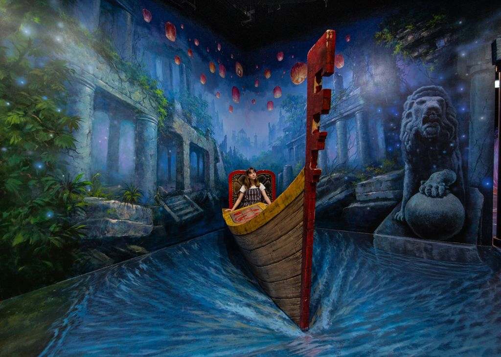 A large painting of a canoe on a wall