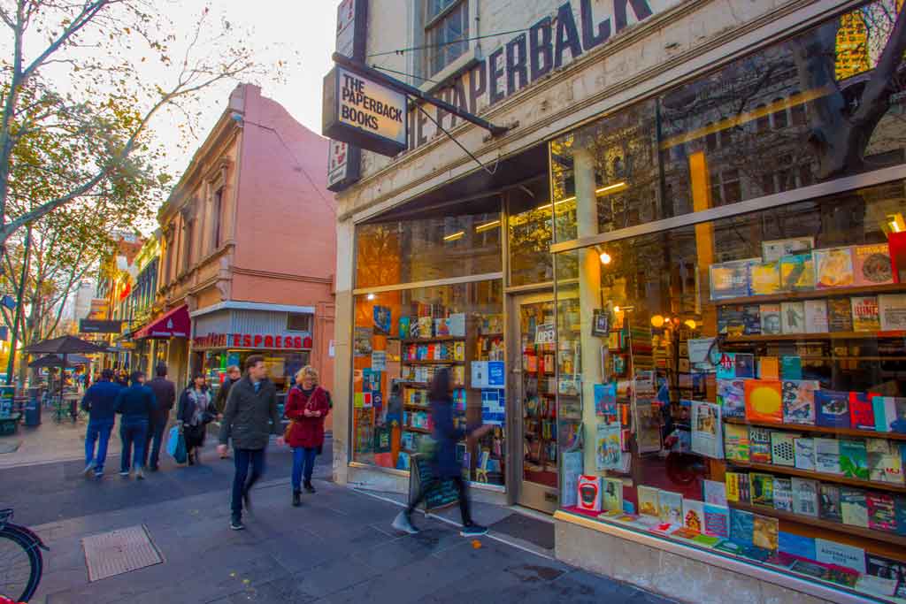 The extrerior of an old fashioned bookshop on a busy street