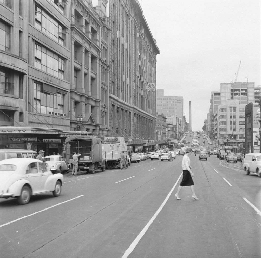 A black and white photo of a city street