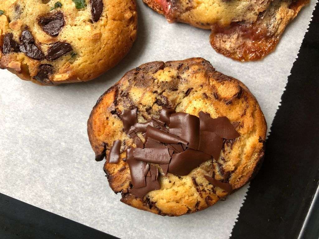 A chocolate chip cookie on a pan