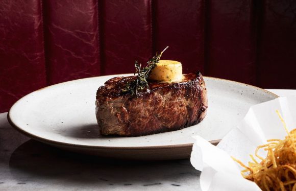 A steak on a white plate
