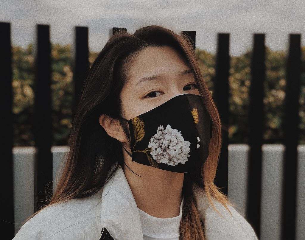 A model in a floral face mask