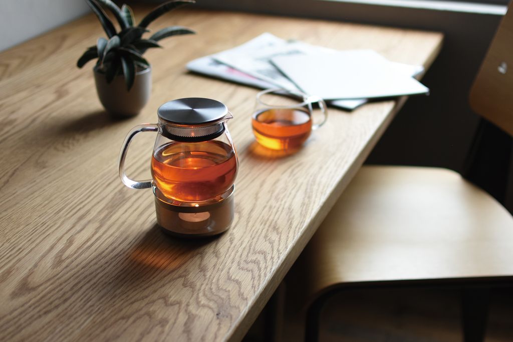 A teapot on a wooden desk