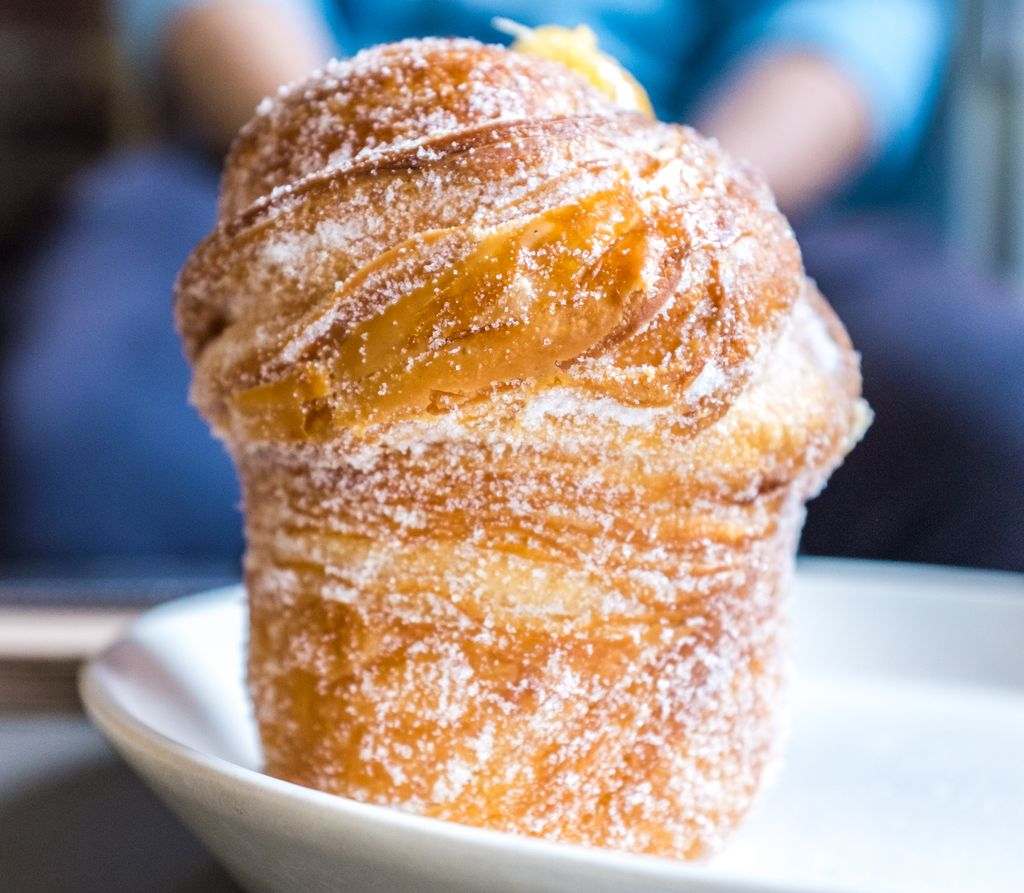 A croissant muffin on a plate
